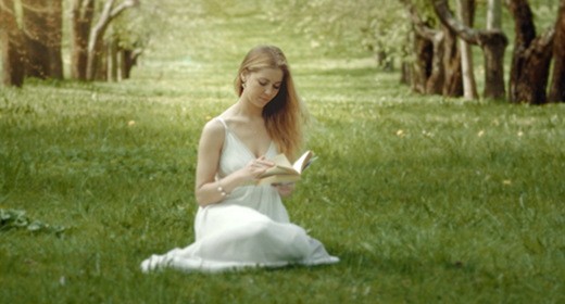 Cute Girl In The Spring Blooming Garden