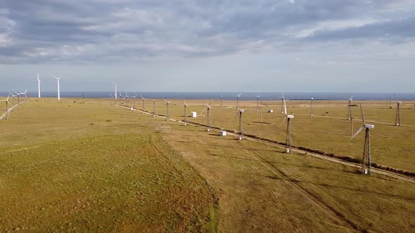 Wind Turbines in the Field in the Distance on the Horizon of the Sea a View From the Height of the
