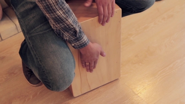 Musician Beat Off a Rhythm On Wooden Box Like Drummer alt