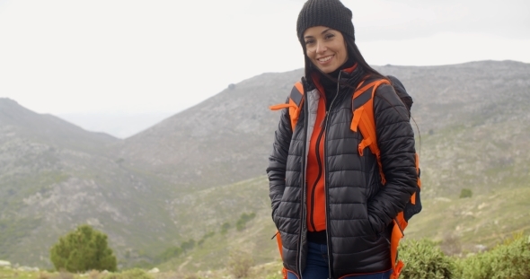 Happy Smiling Woman Enjoying a Misty Hike alt