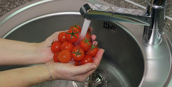 Washing Red Cherry Tomatoes Under Running Tap