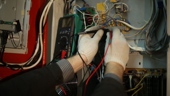 Scientist Makes Electrical Measurements in the Switchboard alt
