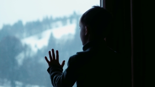 Boy Behind Window In Winter, Stock Footage | VideoHive