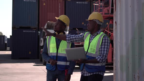 Dock workers team checking containers box from cargo