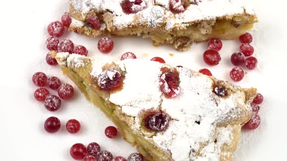 Cranberry-apple pie lies on a plate, homemade cakes for tea and coffee