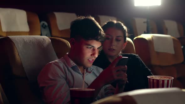 Men Playing Games on Mobile Phone alt