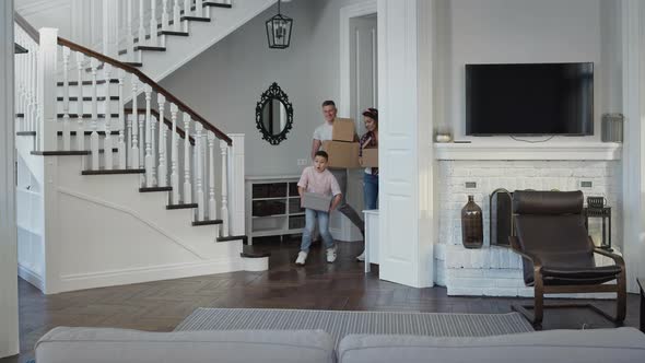 Young Family Enters New Apartment alt