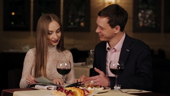 Romantic Date Loving Couple In a Restaurant