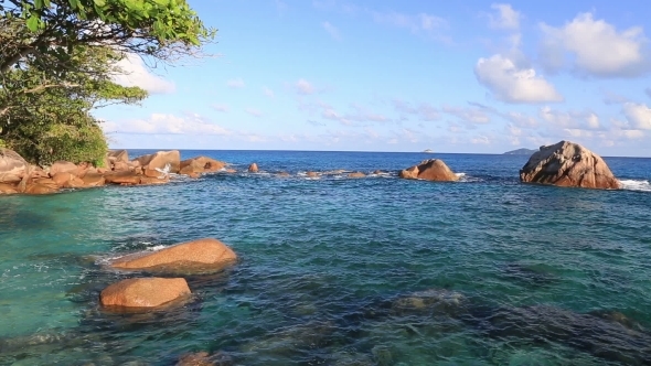 Beautiful Granite Boulders In Indian Ocean On The Beach Of Anse Lazio. alt
