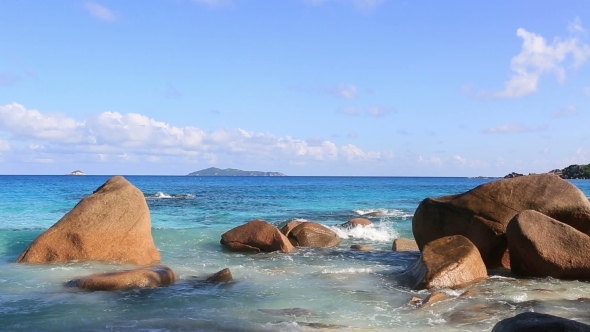 Waves Breaking on Granite Boulders in Beach of Anse Lazio. alt
