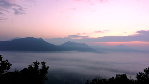 View of the misty landscape with morning sunrise, Time lapse