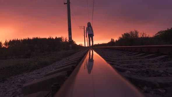 Child Girl Going By The Railroad Track alt