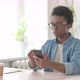 Upset Young African Man Reacting to Loss on Smartphone - VideoHive Item for Sale