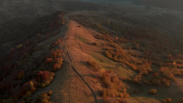 Aerial Reveal Shot of Mountain Valley in Mid Autumn