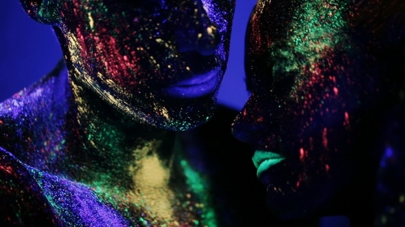 Sexy Man And Woman Glows Under Ultraviolet Light