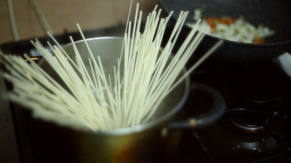 Water Boils in a Pot, and Chef Tosses the Noodles alt