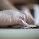 A Sushi Chef Prepares Rolls using a Bamboo Mat - VideoHive Item for Sale