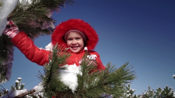 Little Girl Playing With Snowballs