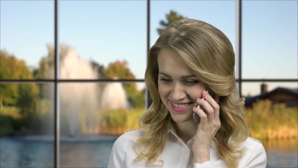 Young Flirty Woman Talking on Cell Phone. alt