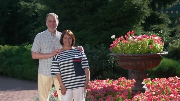 Portrait of Happy Senior Couple in Park alt