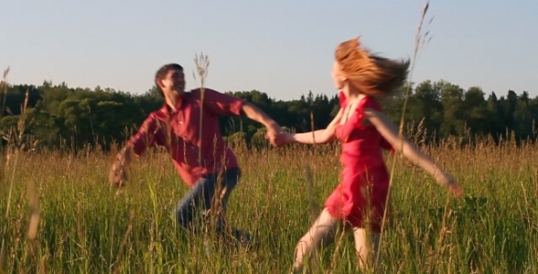 Couple Running in the Field