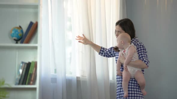 Loving Mother and Wife Waiting for Husband With Little Baby Girl in Arms, Family alt