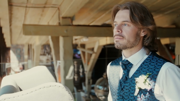 A Beautiful, Elegantly Dressed Man Looking Into The Camera