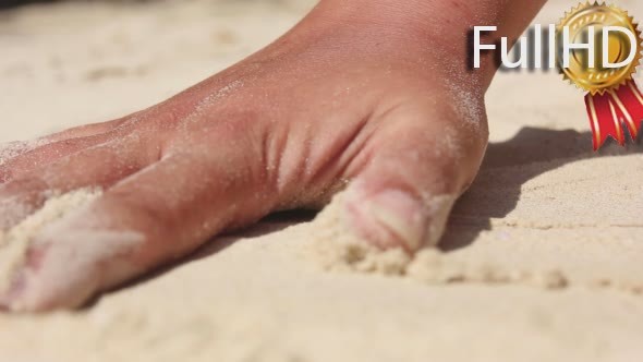 Female Hand Touching White Sand