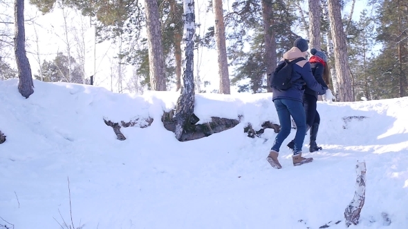 Young And Beautiful Couple In Love Walking In The Winter Woods