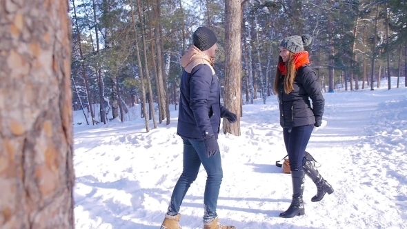 Young And Beautiful Couple In Love Walking In The Winter Woods