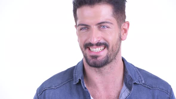 Face of Happy Young Bearded Hipster Man Thinking alt