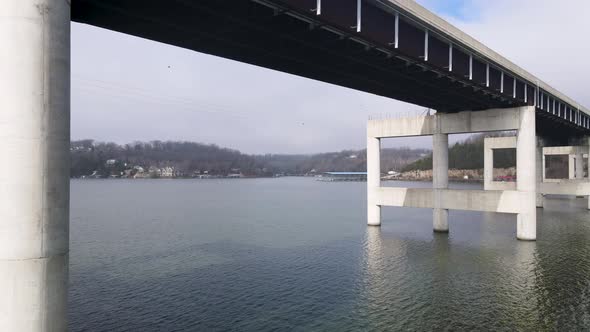 Aerial Flying Under Toll Bridge Crossing Ozarks Lake, Missouri alt