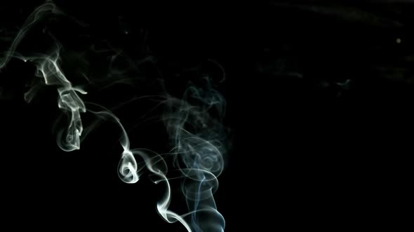 White Stream of Smoke on Black Background. Beautiful Wobble. Close Up. alt
