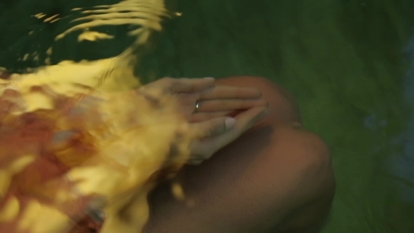Young Girl Sitting In Water