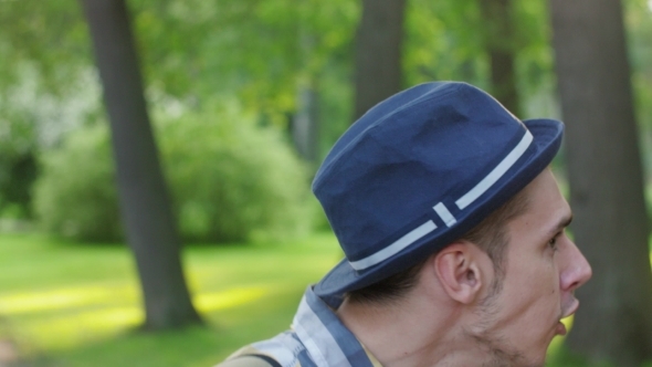 Portrait of Boy in Hat Turn Head, Catch Camera and Smile alt