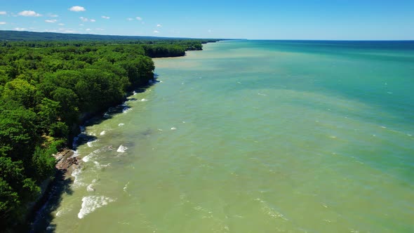 Spectacular Aerial drone video footage of beautiful Lake Erie during summer on a sunny day alt
