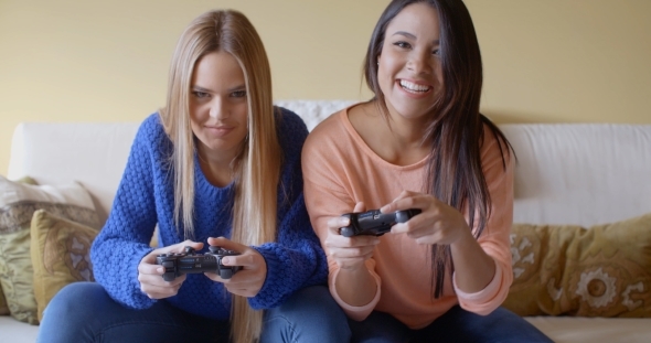 Excited Girls Playing Video Games At Home alt
