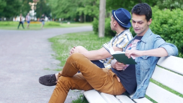 Two Boys Sit On Bench One Read Book, Ask How Much Time Another Boy alt