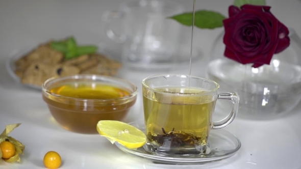 Transparent Cup Of Tea With Honey