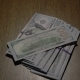 A Stack Of 100 Bills Dollars Falls On The Table - VideoHive Item for Sale