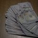 A Stack Of 100 Bills Dollars Falls On The Table - VideoHive Item for Sale