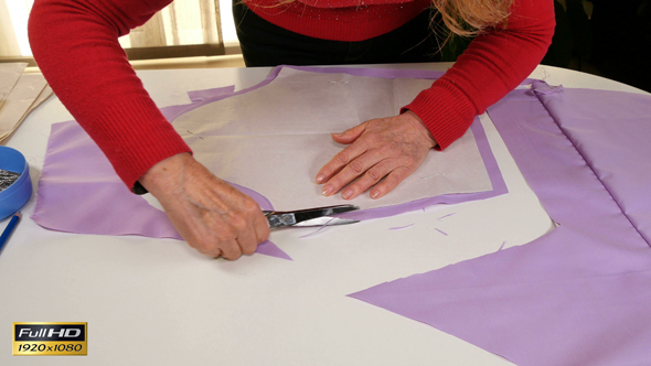 Seamstress Cutting Clothes Pattern alt