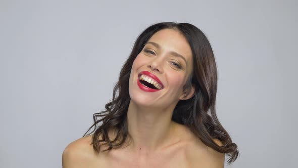 Young Woman with Red Lipstick Laughing  alt