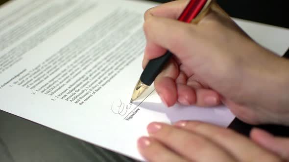 Businesswoman Is Signing A Contract