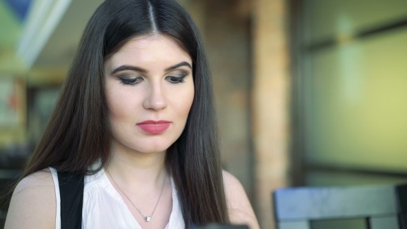 The Girl Watching On Phone And Smile alt