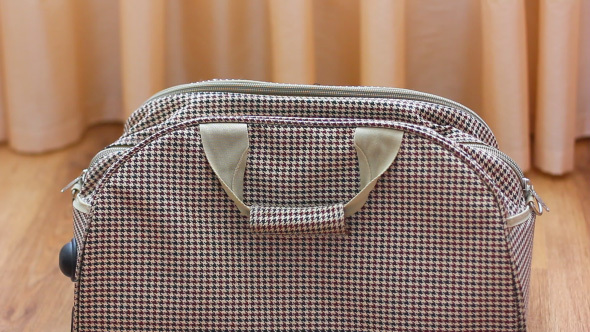 Brown Traveling Bag Closed And Zipped