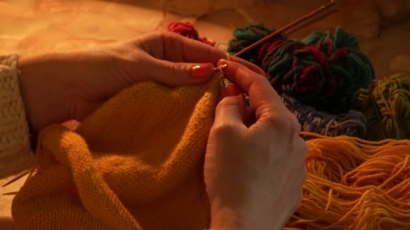 Woman Sitting And Knitting Beautiful Orange