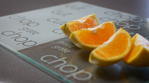 Cutting an Orange on a Chopping Board 2