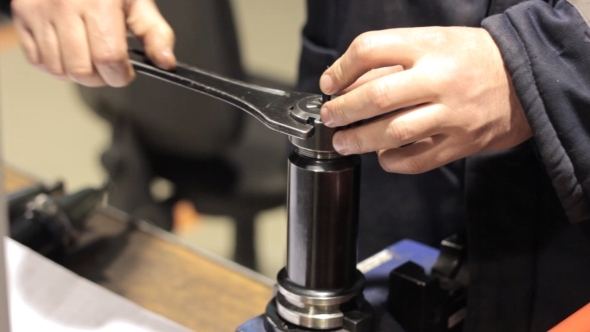  Mechanical Industrial Worker Measuring Detail In Tool Workshop.