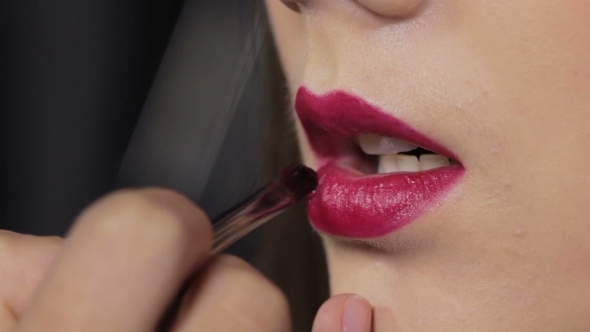 Hot Pink Lipstick. Lip Gloss On Sexy Lips And Brush. Makeup